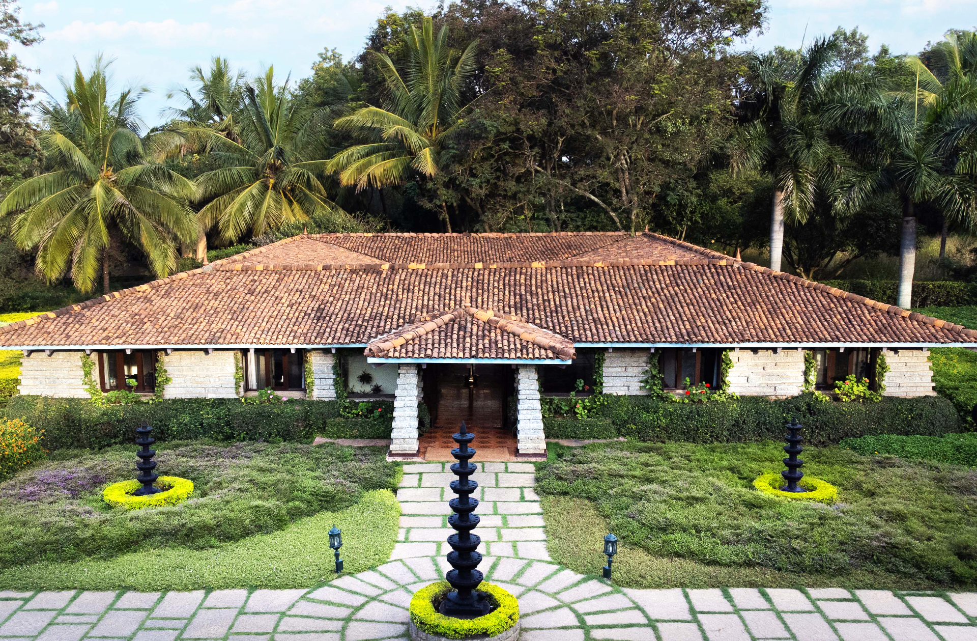 SOUKYA campus front view with traditional architecture and serene greenery