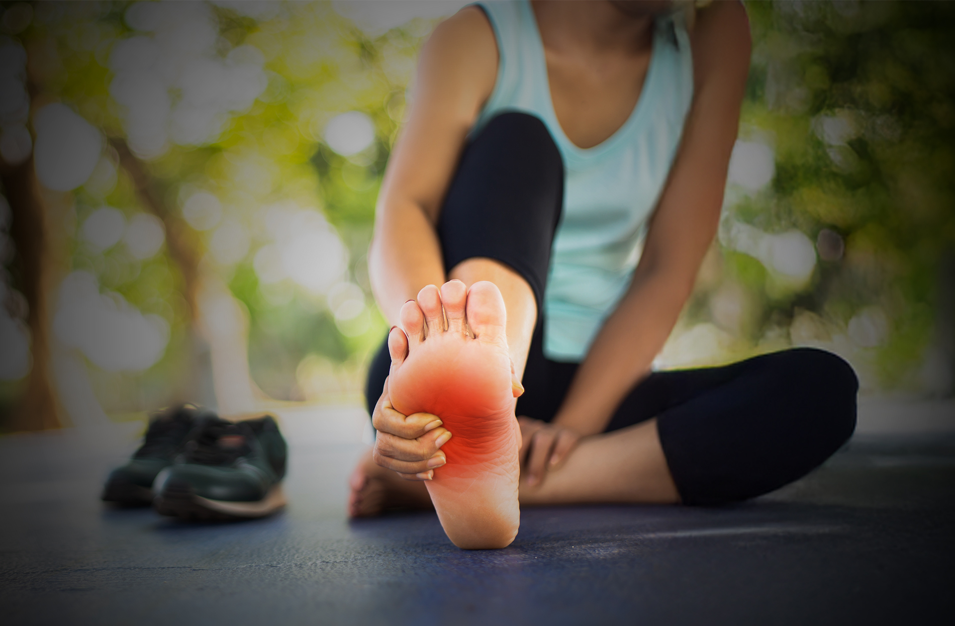 Person experiencing peripheral neuropathy foot pain during stretching